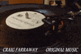 a craig farraway original music record being played on a turntable