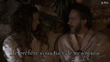 a man and a woman are looking at each other and the words je prefere vous tuer de mes mains are above them