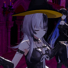 a girl in a witch hat is standing next to another girl in a black dress