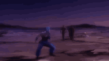 a man in blue pants is jumping in the air in a desert