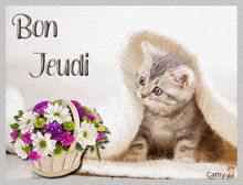 a picture of a kitten and a basket of flowers with the words bon jeudi