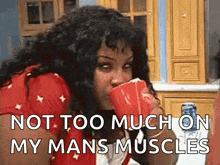 a woman drinking from a red cup with the words not too much on my mans muscles below her