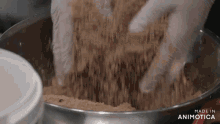 a person is mixing ingredients in a bowl with the words made in animotica on the bottom