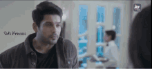 a man is looking at a woman in a room with the words ' sid 's princess ' on the bottom right