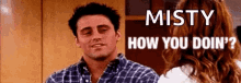 a man in a plaid shirt is talking to a woman in a kitchen and says `` misty how you doin ? ''