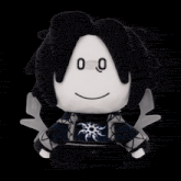 a black and white stuffed animal with a face that says ' 00 ' on it