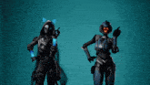 two female soldiers are standing next to each other with their arms outstretched