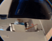 a reflection of a person holding a hdmi2 device