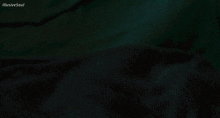 a man is laying in bed with his hand on his face and the words illusive soul written above him