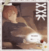 a picture of a boy laying on a couch with the words akito solo de kitt written below him