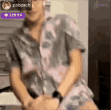 a blurry picture of a person with the name pbbzach visible