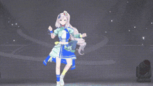 a girl in a blue and green dress is standing in front of a dark background .