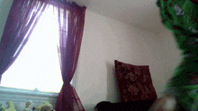 a room with red curtains and a window