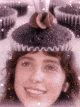 a woman wearing a cupcake on her head