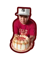a man wearing a red shirt that says sullen holds a cake
