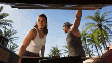 a man and a woman standing in the back of a car
