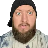 a man with a beard wearing a hat and tie dye shirt