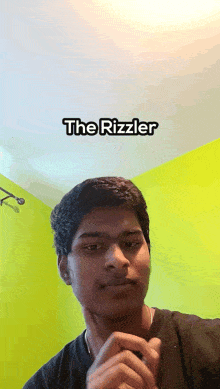 a young man is making a funny face with the words the rizzler above him