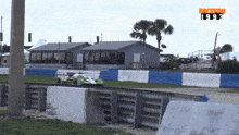 a race car is going down a track with the year 1993 on the bottom