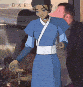 a woman in a blue dress is standing in front of a bar