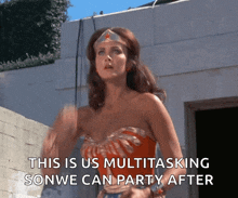 a woman in a wonder woman costume says this is us multitasking sonwe can party after
