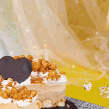 a slice of cake on a white plate with nuts on top