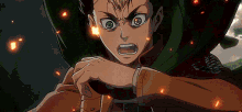 a close up of a person 's face with fire coming out of their mouth
