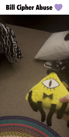 a picture of a stuffed bill cipher with the words bill cipher abuse at the top