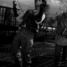 a black and white photo of a man dancing with the name jungkook on the bottom