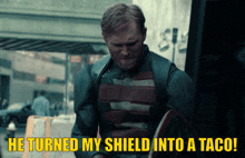 a man in a superhero costume says he turned my shield into a taco