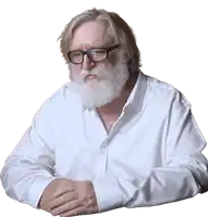 a man with a beard wearing glasses and a white shirt