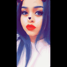 a girl with a heart on her nose and red lipstick