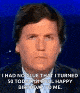 a man in a suit and tie is making a funny face while talking on a television .
