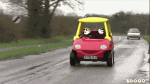 a red toy car with a yellow top has a license plate that says xklw hbl