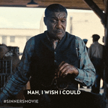 a man in a vest says nah i wish i could on a screen
