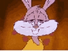 a close up of a cartoon rabbit 's face with a sad look on its face .