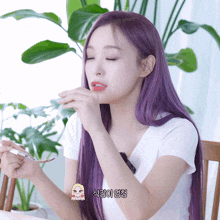 a woman with purple hair is holding a fork in her hand