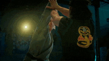 a man with a bandage on his head has the letter c on his headband
