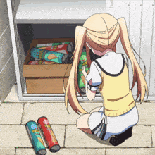 a girl is looking at a box of pringles
