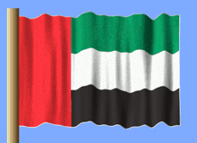 the flag of the united arab emirates is waving in the wind against a blue sky