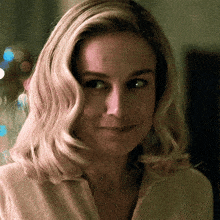 a close up of a woman 's face with her eyes closed