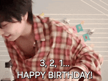 a man in a plaid shirt says " happy birthday "