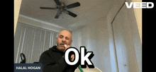 a man brushing his teeth in front of a mirror with the word ok on the bottom