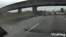 a video of a person riding a motorcycle on a highway is being shared on viralhog