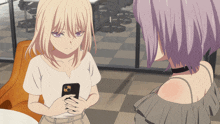 a girl with purple hair is looking at a phone