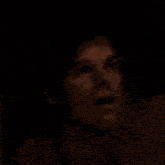 a man is looking at a woman laying on a table