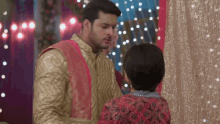 a man and a woman are standing next to each other