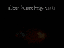 a close up of a person 's mouth with the words " ilter buaz koprusu " on the bottom