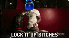 a man with a padlock on his head and the words lock it up bitches behind him