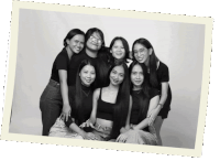 a black and white photo of a group of women